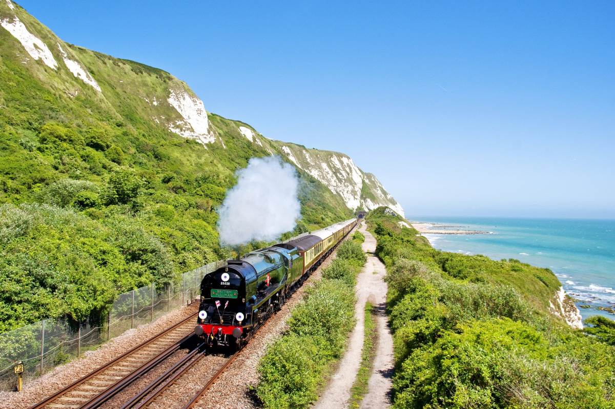 the british pullman train with summer coastal view